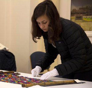 Photo of Margot Steiner with museum textiles