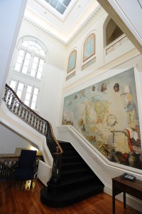 Image of the Stuart Travis mural and central staircase.