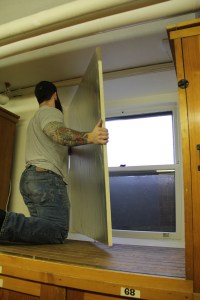 Contractor covering the windows with insulation