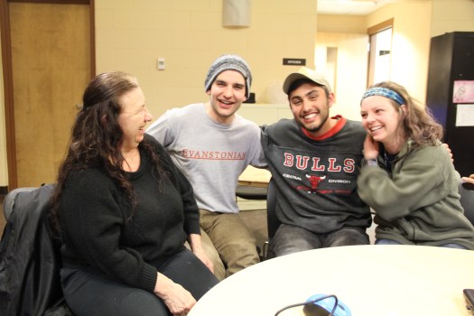 Image of three college students talking with tribal member Diana King, taken March 2016.