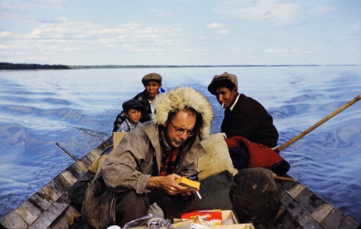 Richard MacNeish in canoe in the MacKenzie River, Canada, during his survey work in the 1950s