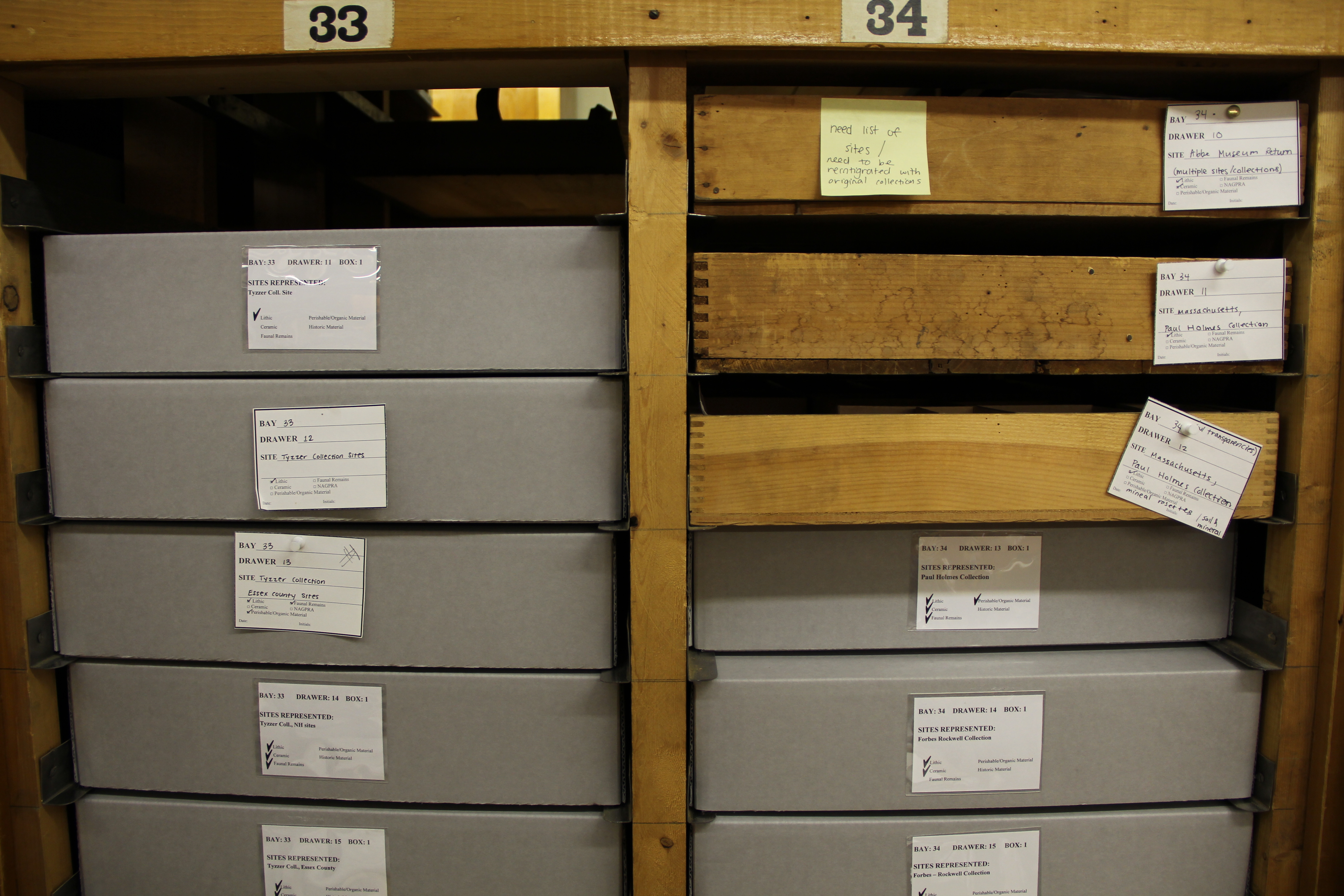 Image of new storage cartons and old wooden storage drawers.