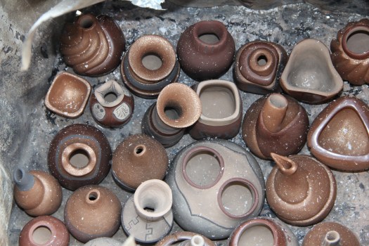 Image of soot covered vessels post firing.