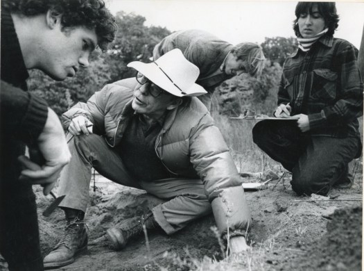Image of Peabody director Scotty MacNeish showing students how to excavate at the Andover town dump site.