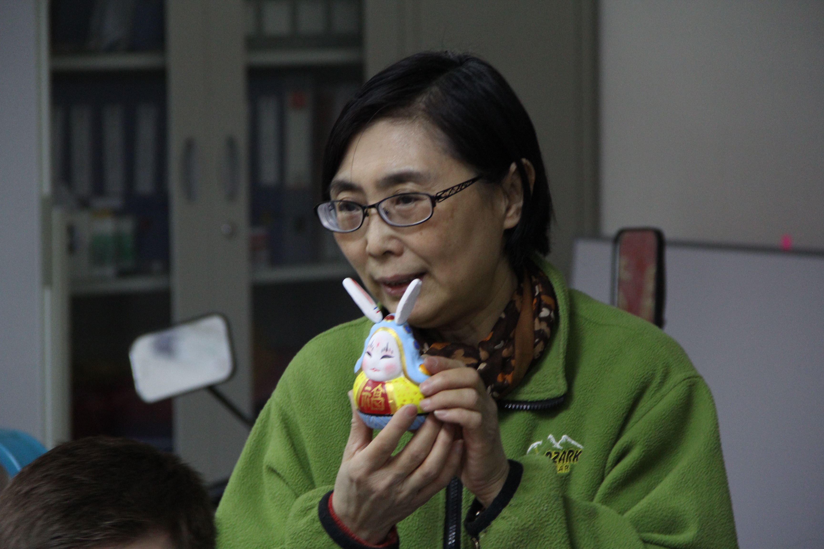Image of Beijing Tu'er Ye artist with figurine.