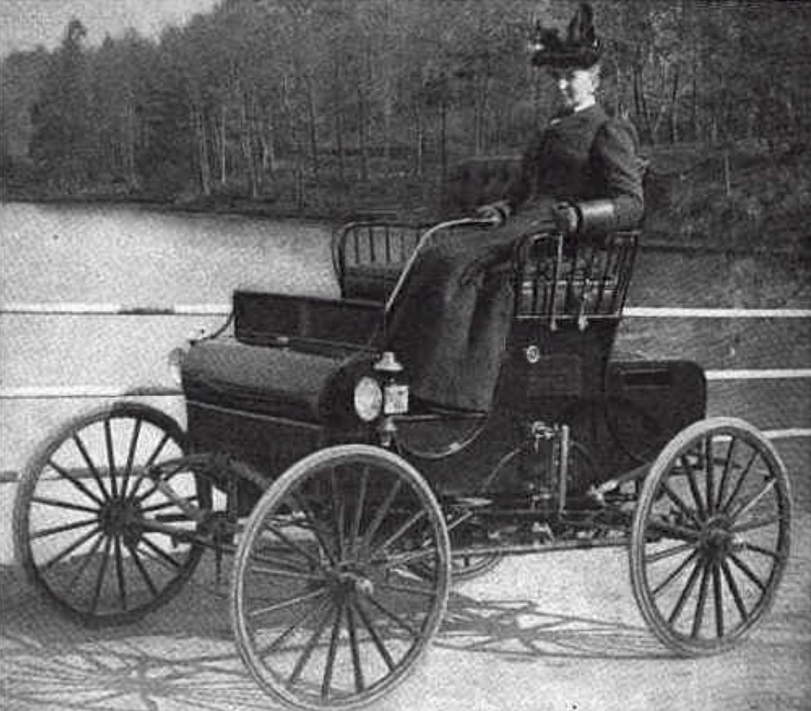 Advertisement for the 1901 Kidder Steam Runabout motor vehicle, showing woman sitting in driver's seat